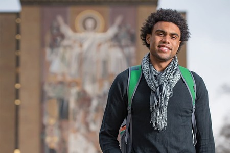 Corey Robinson in front of the Hesburgh Library